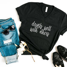 Load image into Gallery viewer, Drinks Well With Others V-Neck T-Shirt (Black)